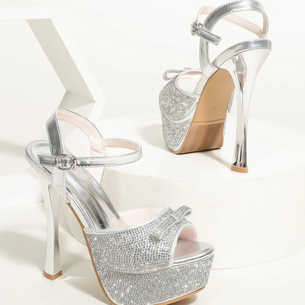 Aneikeh 2026 Estate Sandali con plateau con tacco ultra alto Cinturino sexy Tacco sottile Acqua Diamante Fiocco Moda Scarpe da discoteca per feste