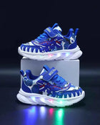 Scarpe sportive per bambini nuove primaverili Dinosauro del fumetto Scarpe leggere a LED per bambini Suola morbida Scarpe da ginnastica causali per ragazzi 2-6 anni