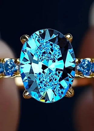 Huitan Luxury Ring for Women, Versatile Gold Accessory for Parties, Simple Style with Sparkling Blue Zircon Setting, Elegant Jewelry for Weddings
