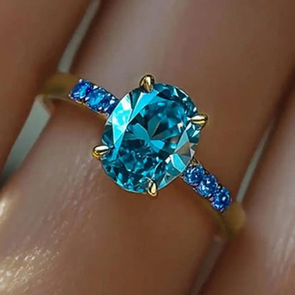 Anello di Lusso Huitan per Donna, Versatile Accessorio Dorato per Feste, Stile Semplice con Incastonatura di Zirconi Blu Brillanti, Gioiello Elegante per Matrimoni