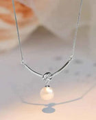 Huitan Elegante Collana con Ciondolo a Nodo per Donna, Perla Sintetica, Accessori Versatili per Matrimoni e Fidanzamenti, Gioielli di Lusso alla Moda per Signore