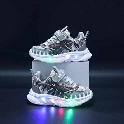 Scarpe sportive per bambini nuove primaverili Dinosauro del fumetto Scarpe leggere a LED per bambini Suola morbida Scarpe da ginnastica causali per ragazzi 2-6 anni