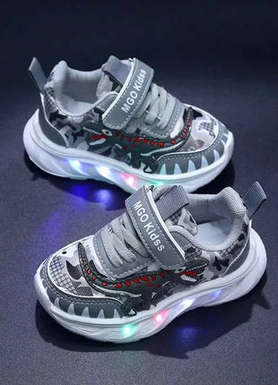 Scarpe sportive per bambini nuove primaverili Dinosauro del fumetto Scarpe leggere a LED per bambini Suola morbida Scarpe da ginnastica causali per ragazzi 2-6 anni
