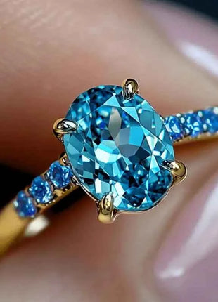 Anello di Lusso Huitan per Donna, Versatile Accessorio Dorato per Feste, Stile Semplice con Incastonatura di Zirconi Blu Brillanti, Gioiello Elegante per Matrimoni