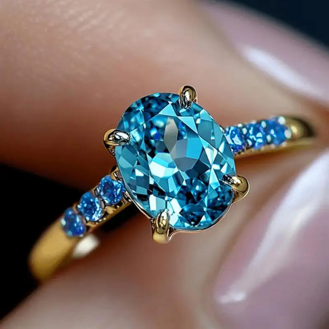 Anello di Lusso Huitan per Donna, Versatile Accessorio Dorato per Feste, Stile Semplice con Incastonatura di Zirconi Blu Brillanti, Gioiello Elegante per Matrimoni