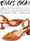 A PAIR OF ORANGE SHOES